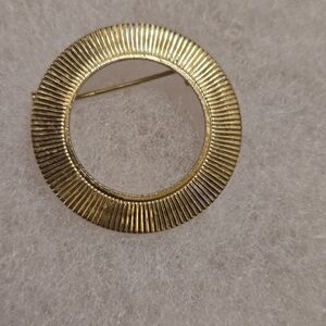 Elegant Gold Circular Brooch